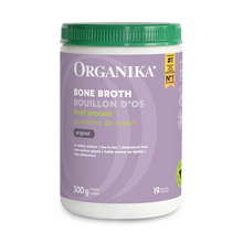 Organika Bone Broth container with green lid on a green background