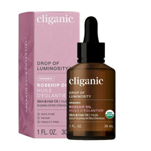 Cliganic organic rosehip oil bottle and packaging on a beige background