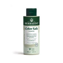 A bottle of Herbatint Color Safe Shampoo with a green and white label, indicating that it is formulated for color-treated hair and dermatologically tested.