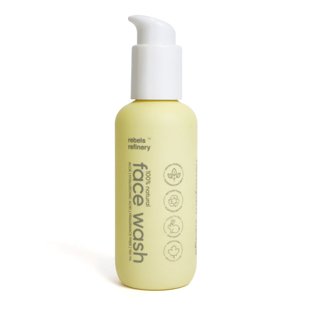 Bottle of face wash with pump dispenser on a white background
