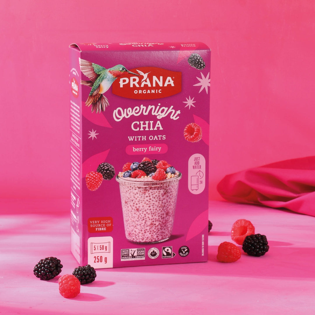 Prana Organic Overnight Chia with Oats packaging on a pink background with berries.