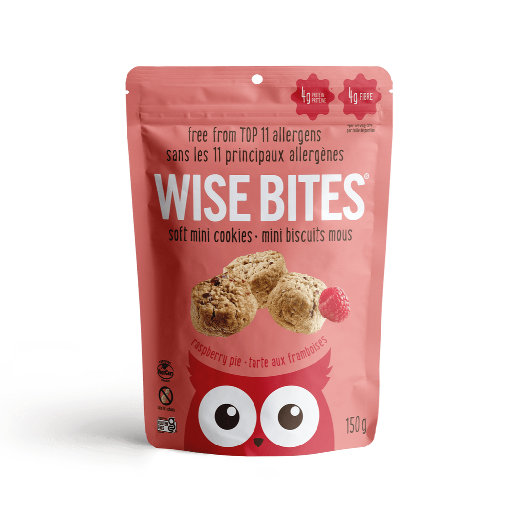 Pink package of Wise Bites soft mini cookies on a green background