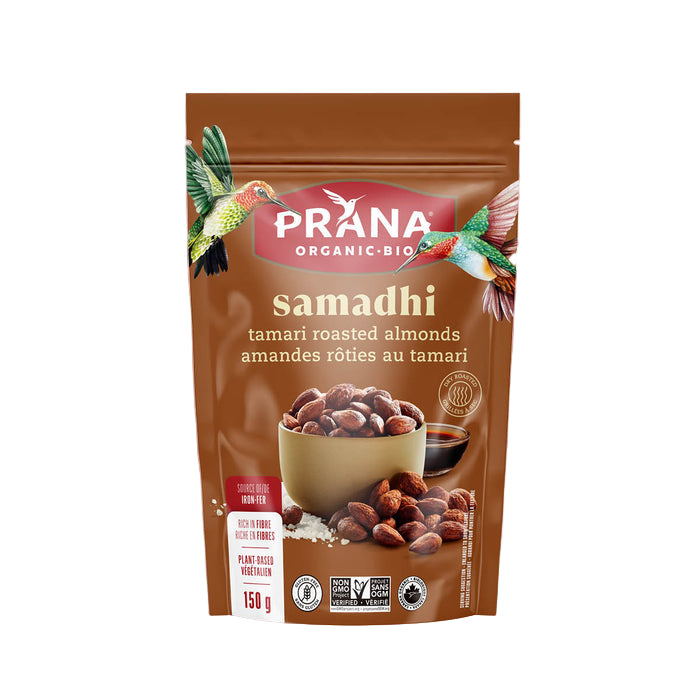 Prana Organic Bio samadhi tamari roasted almonds packaging on a pink background