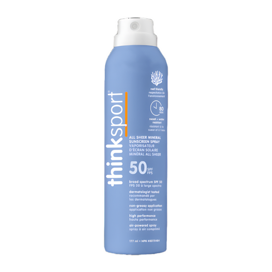 Blue sunscreen spray bottle with white cap on a white background